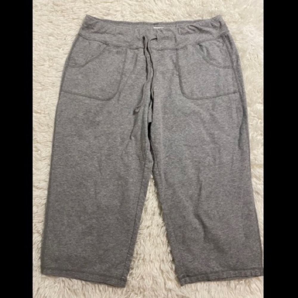Grey capris, athletic wear.